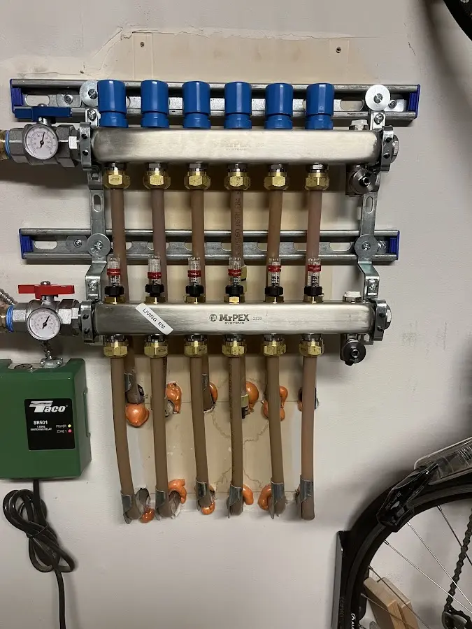 Plumber performing Water Heater Repair at a residential property in Forest